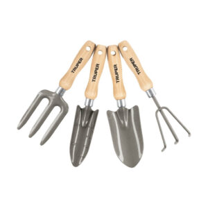 Set of wooden-handled gardening tools (rake, trowels, cultivator, and cultivator with fork) laid side by side as a kit.