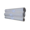 Three large white LDPE film rolls wrapped in plastic, stacked in a row with visible labels on each roll