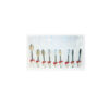 Assorted dental drill burs in a clear blister pack with red labels, showing different shapes and sizes.