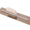 Plastering trowel with a wooden handle and metal blade placed on a brown board, used to spread and smooth plaster or cement on walls.