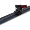 Precision rail-mounted adjustment tool with a red cylindrical aiming unit on a dark blue bar, used for alignment or measurement setups.